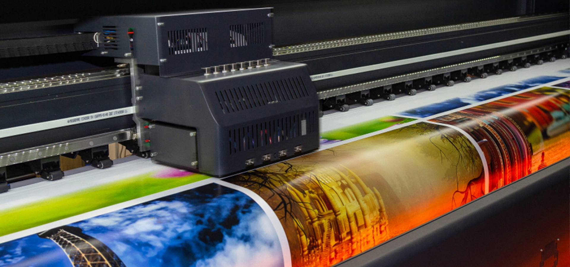 A digital printer printing a big roll of paper.
